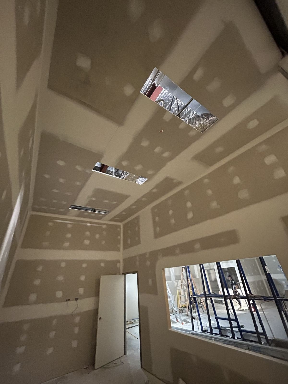 Commercial fitout room with plasterboard ceiling and service openings, Perth